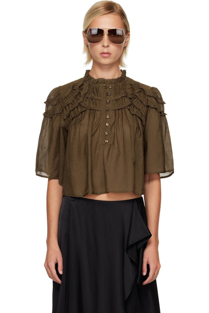 Semi-sheer organic cotton voile blouse. 

· Scalloped edges and gathering throughout
· Round neck
· Eight-button placket

Supplier color: Dark khaki