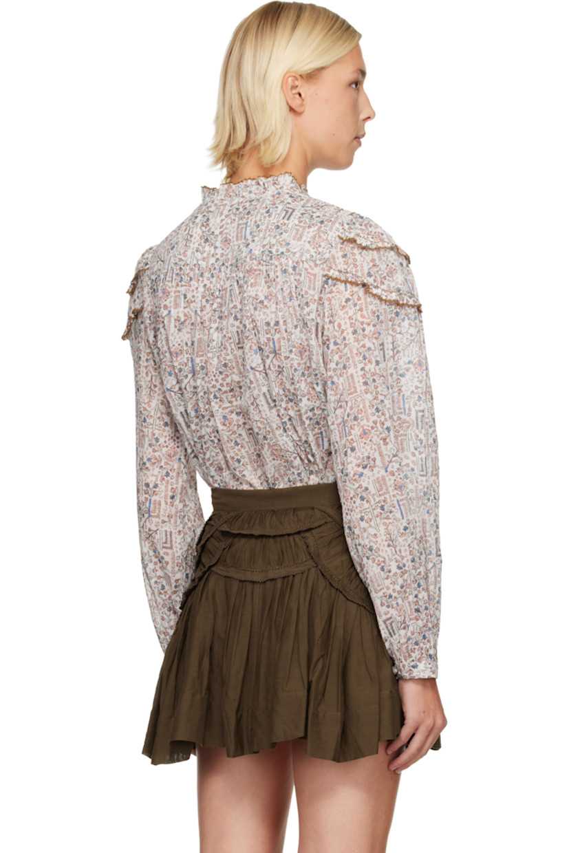Semi-sheer cotton poplin blouse.

· Graphic pattern printed throughout
· Lace trim at round neck
· Button closure
· Panels with lace trim at shoulders
· Gathering at cuffs and back yoke
· Button fastening at cuffs

Supplier color: Ecru