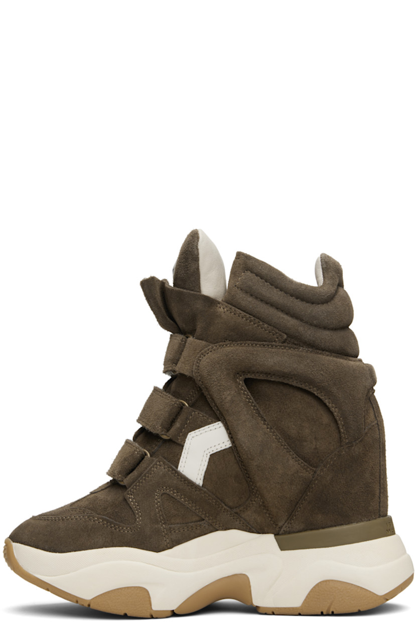 High-top calfskin suede sneakers.

· Perforated detailing at toe
· Velcro closure
· Logo patch at padded tongue
· Quilted padded collar
· Cutout and logo appliqué at sides
· Logo embossed at heel counter
· Grained leather lining
· Concealed wedge heel
· Treaded rubber platform sole
· Platform: H2"
· Heel: H4"

Supplier color: Khaki/Ecru