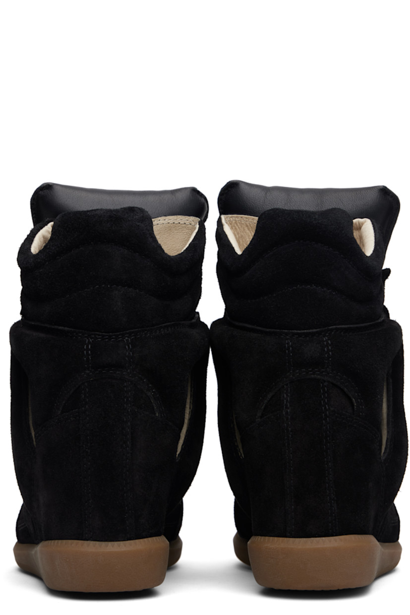 High-top calfskin suede sneakers.

· Perforated detailing at toe
· Velcro closure
· Padded tongue
· Quilted padded collar
· Cutout and logo appliqué at sides
· Logo embossed at heel counter
· Grained leather lining
· Concealed wedge heel
· Treaded rubber sole
· Heel: H3.25"

Supplier color: Black
