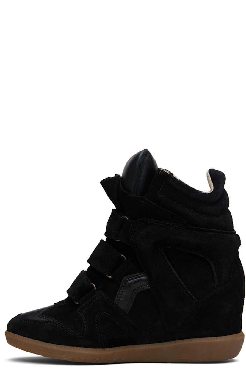 High-top calfskin suede sneakers.

· Perforated detailing at toe
· Velcro closure
· Padded tongue
· Quilted padded collar
· Cutout and logo appliqué at sides
· Logo embossed at heel counter
· Grained leather lining
· Concealed wedge heel
· Treaded rubber sole
· Heel: H3.25"

Supplier color: Black