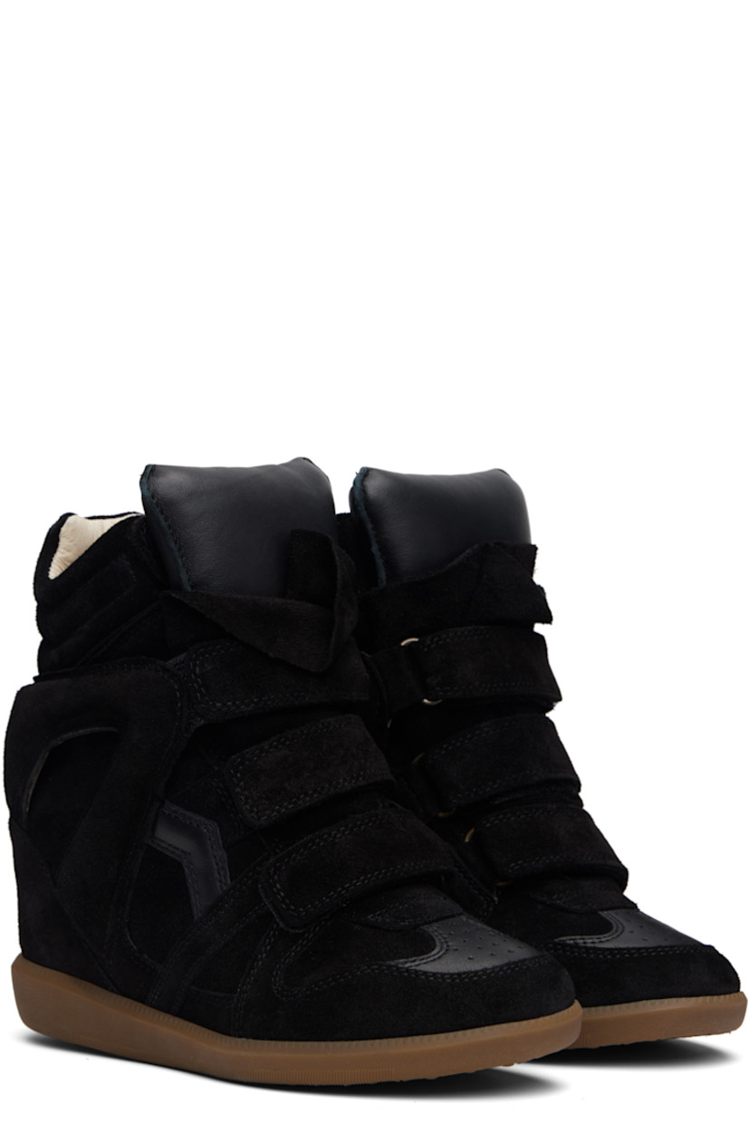 High-top calfskin suede sneakers.

· Perforated detailing at toe
· Velcro closure
· Padded tongue
· Quilted padded collar
· Cutout and logo appliqué at sides
· Logo embossed at heel counter
· Grained leather lining
· Concealed wedge heel
· Treaded rubber sole
· Heel: H3.25"

Supplier color: Black