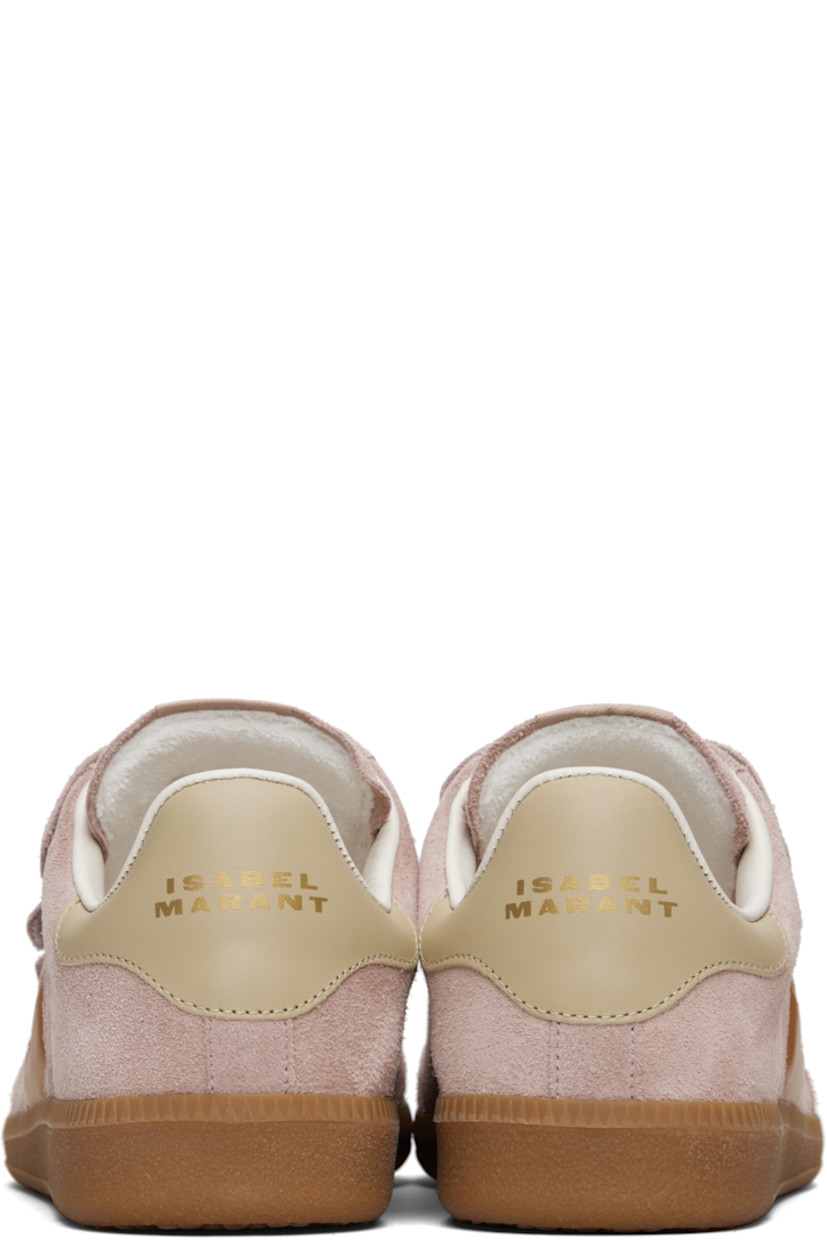 Low-top calfskin suede sneakers.

· Perforated detailing at toe
· Velcro closure
· Logo patch at padded tongue
· Padded collar
· Inset logo at outer side
· Logo stamp at heel tab
· Terrycloth lining
· Treaded rubber sole

Supplier color: Faded pink/Honey