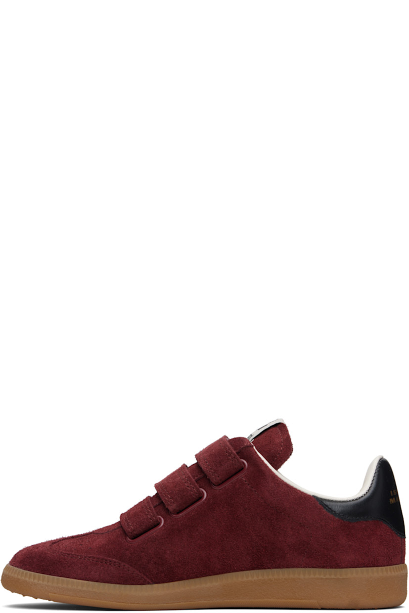 Low-top suede sneakers.

· Perforated detailing at toe
· Velcro closure
· Logo patch at padded tongue
· Padded collar
· Inset logo at outer side
· Logo stamp at heel tab
· Terrycloth lining
· Treaded rubber sole

Supplier color: Burgundy/Ecru