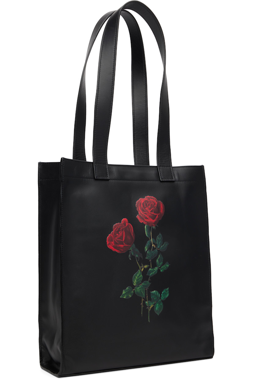 Buffed lambskin tote.

· Fixed shoulder straps
· Graphic printed at face
· Logo stamp at back face
· Patch pocket at interior
· Twill lining
· H14" x W12" x D3.25"

Supplier color: Floral black leather