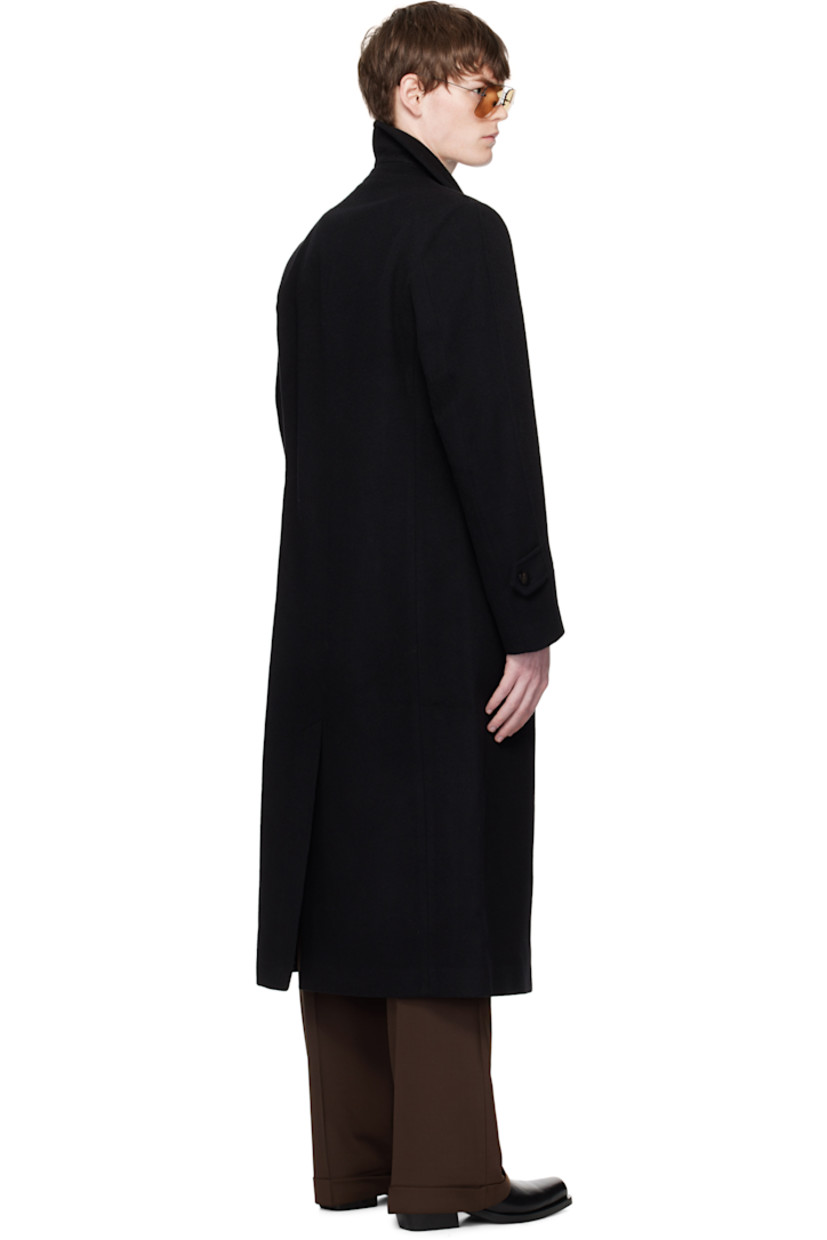 Wool- and cashmere-blend melton coat. 

· Spread collar
· Button closure
· Welt pockets 
· Padded shoulders
· Button tab at cuffs
· Central vent at back hem
· Welt pocket at interior
· Full satin lining

Supplier color: Black