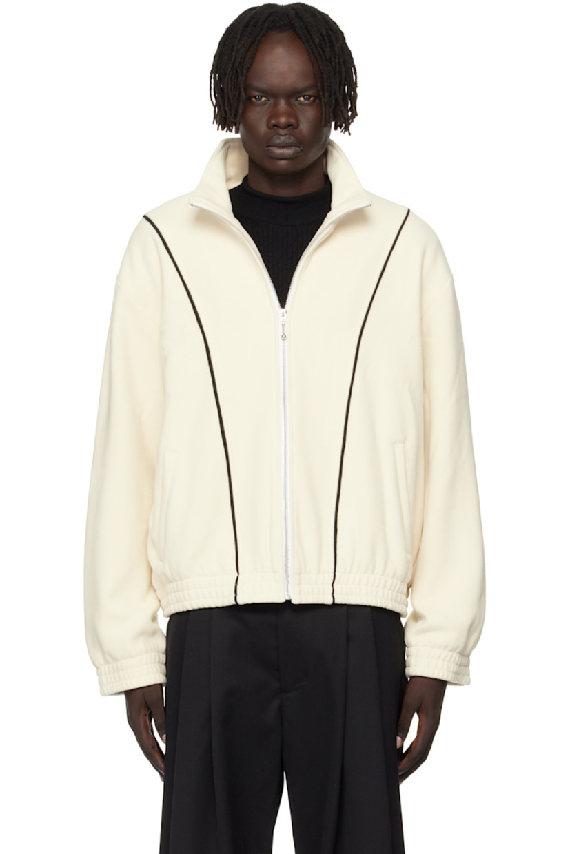 Stretch fleece track jacket. 

· Stand collar
· Zip closure
· Twill trim at front and back  
· Welt pockets at waist 
· Elasticized hem and cuffs
· Welt pockets at interior
· Fully lined

Supplier color: Off-white