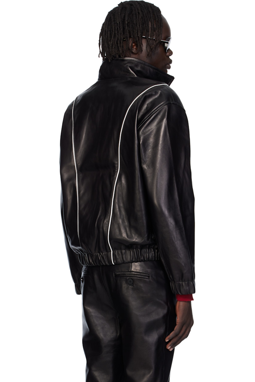 Grained lambskin jacket. 

· Piping throughout
· Stand collar 
· Zip closure
· Welt pockets at waist
· Elasticized hem and cuffs
· Full satin twill lining

Supplier color: Black leather