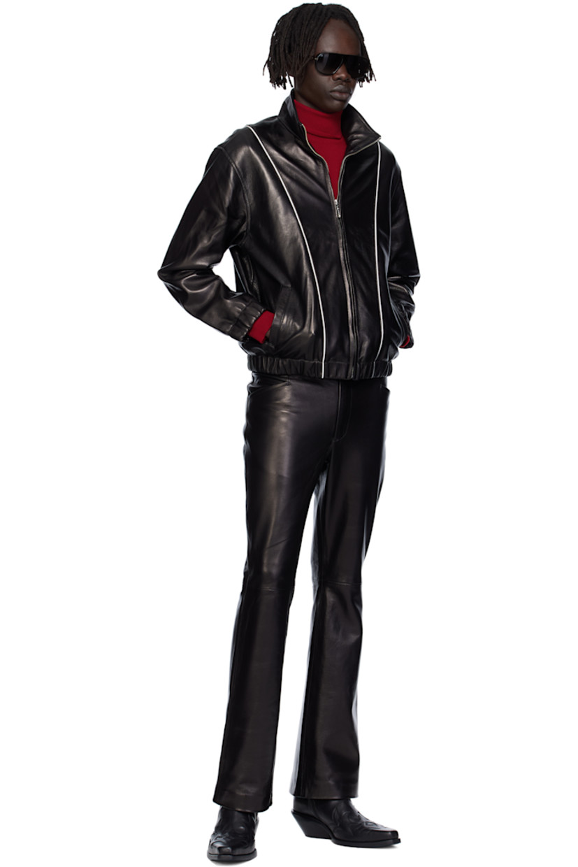 Grained lambskin jacket. 

· Piping throughout
· Stand collar 
· Zip closure
· Welt pockets at waist
· Elasticized hem and cuffs
· Full satin twill lining

Supplier color: Black leather