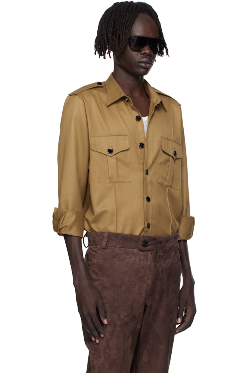 Virgin wool-blend twill overshirt. 

· Spread collar 
· Button closure
· Flap pockets at chest
· Pinched seams at front 
· Shirttail hem 
· Epaulets
· Pleats at buttoned barrel cuffs

Supplier color: Camel