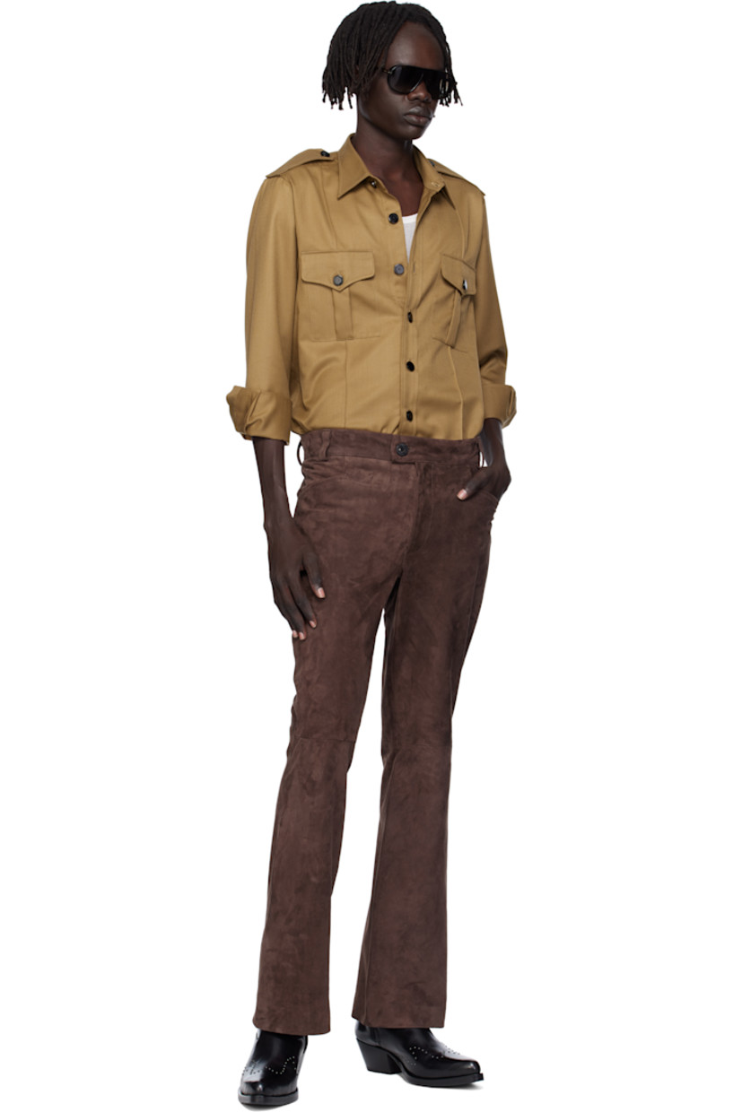 Virgin wool-blend twill overshirt. 

· Spread collar 
· Button closure
· Flap pockets at chest
· Pinched seams at front 
· Shirttail hem 
· Epaulets
· Pleats at buttoned barrel cuffs

Supplier color: Camel