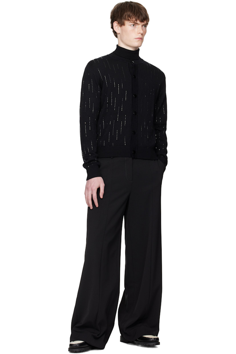 Knit virgin wool cardigan.

· Crystal appliqués throughout
· Rib-knit crewneck, hem, and cuffs
· Button closure

Supplier color: Black Crystal