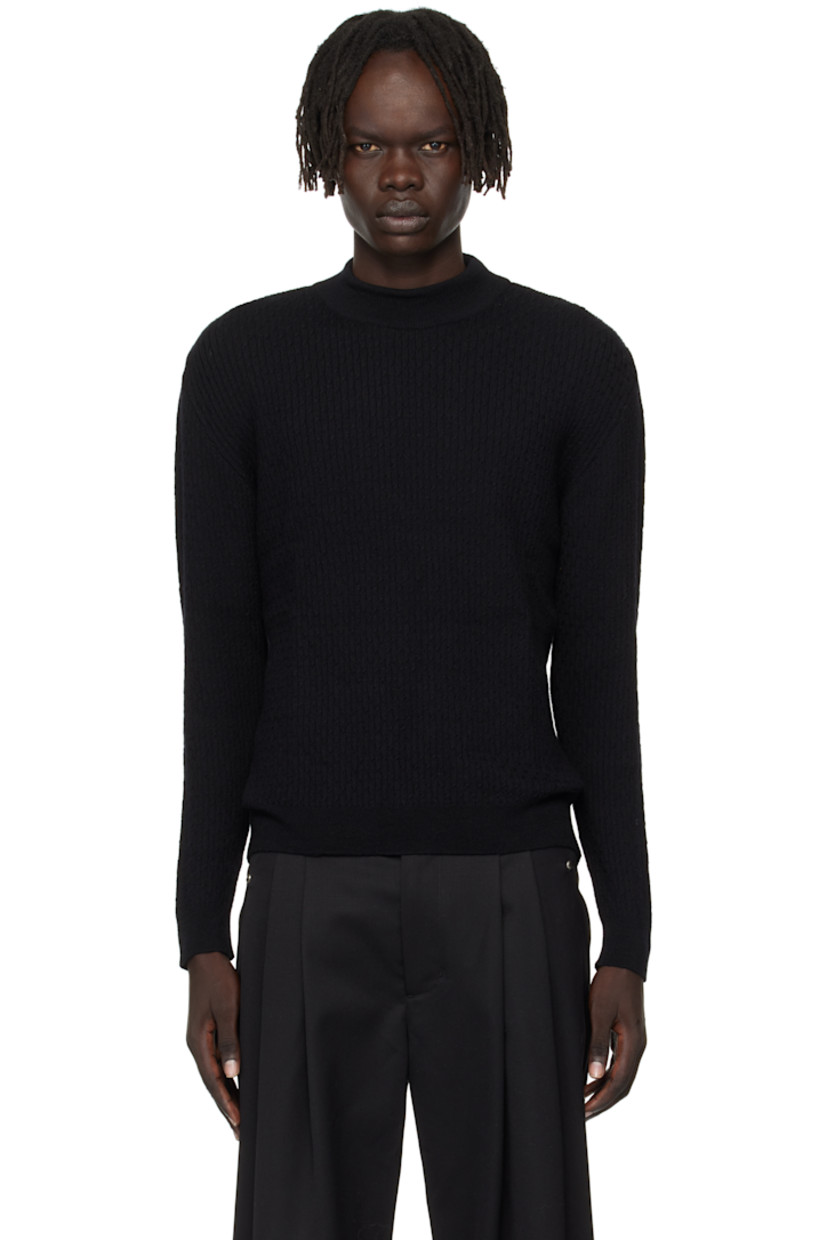 Cable-knit virgin wool sweater. Rib-knit mock neck, hem, and cuffs.

Supplier color: Black