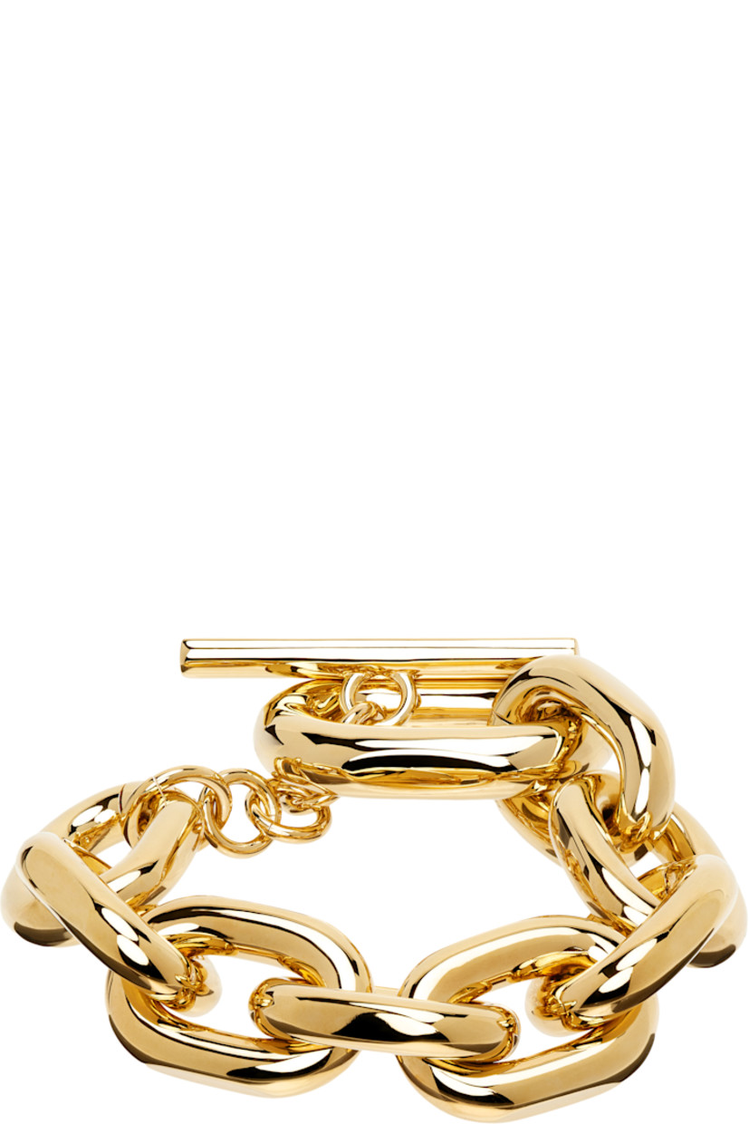 Cable chain bracelet in gold-tone brass.

· Logo-engraved toggle fastening
· L9"

Supplier color: Gold