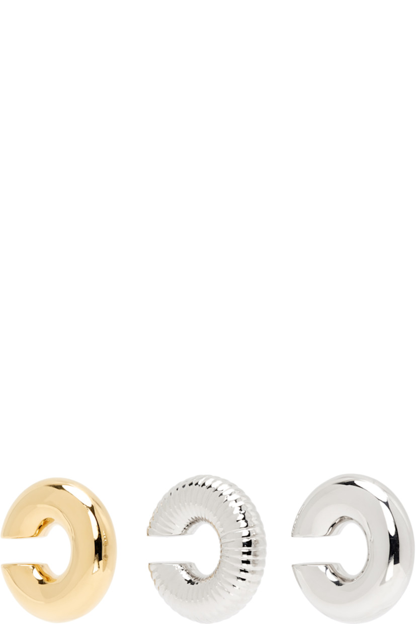 Set of three single ear cuffs in silver- and gold-tone brass.

· Fluted detailing throughout 
· D1"

Supplier color: Silver/Gold
