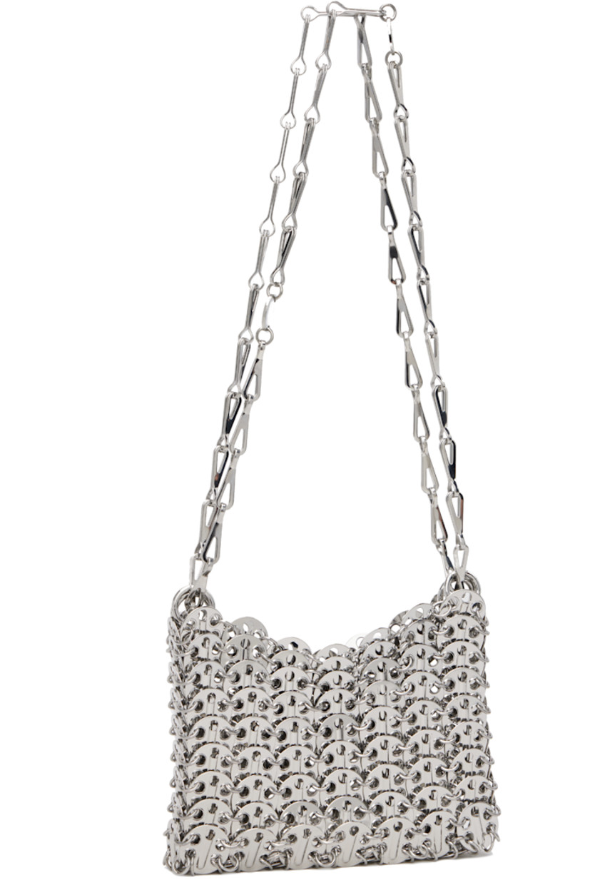 Handcrafted chain-mail-style shoulder bag in silver-tone brass.

· Sliding chain-link shoulder straps
· Logo plaque at shoulder strap
· Open throat
· Unlined
· H4" x W6" x D1"

Supplier color: Silver