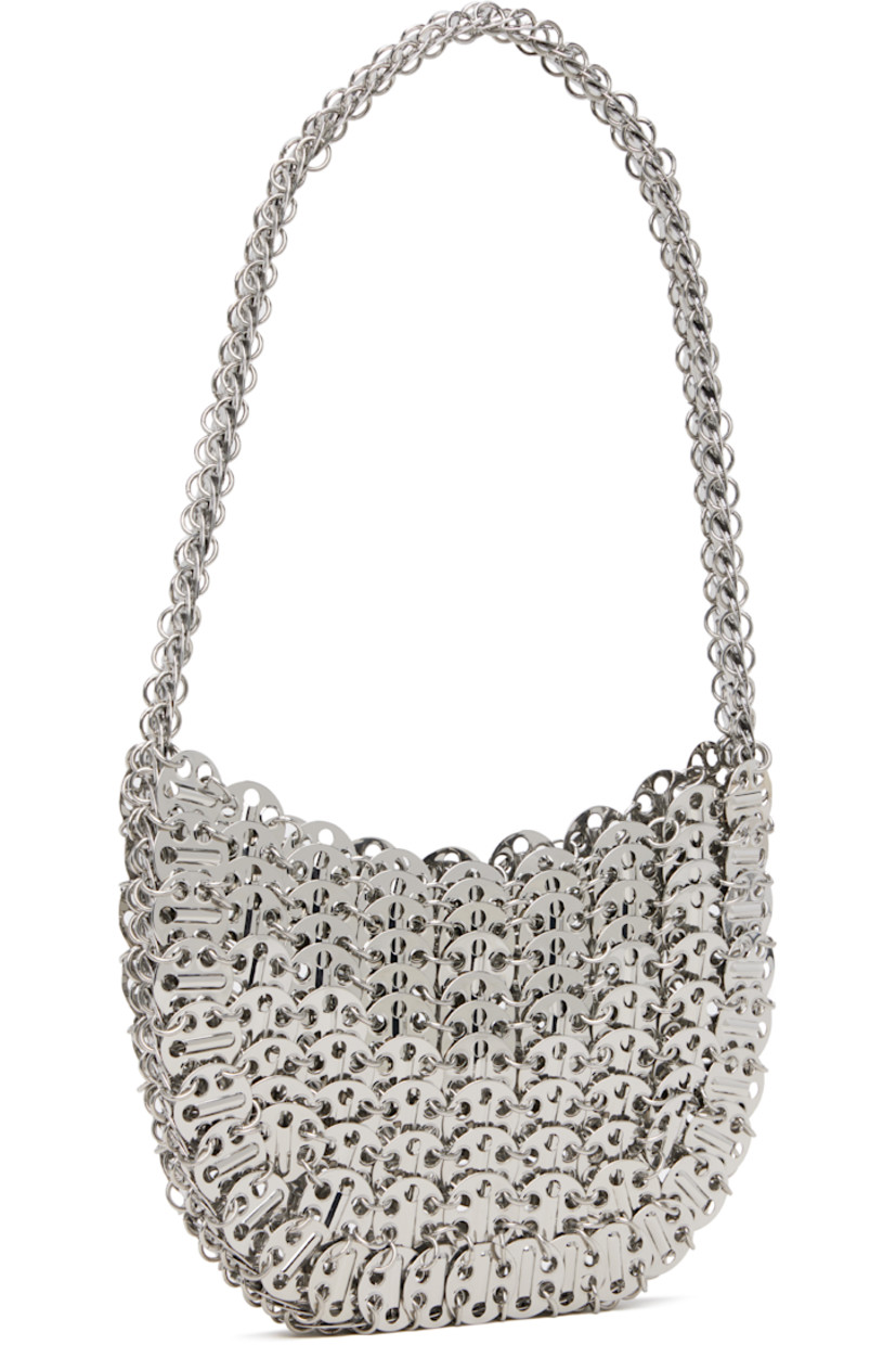 Handcrafted chain-mail-style shoulder bag in silver-tone brass.

· Fixed shoulder strap
· Open throat
· Unlined
· H5" x W7" x D1"

Supplier color: Silver