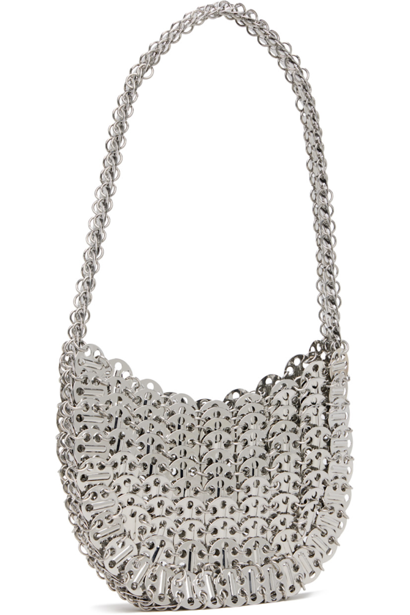 Handcrafted chain-mail-style shoulder bag in silver-tone brass.

· Fixed shoulder strap
· Open throat
· Unlined
· H5" x W7" x D1"

Supplier color: Silver