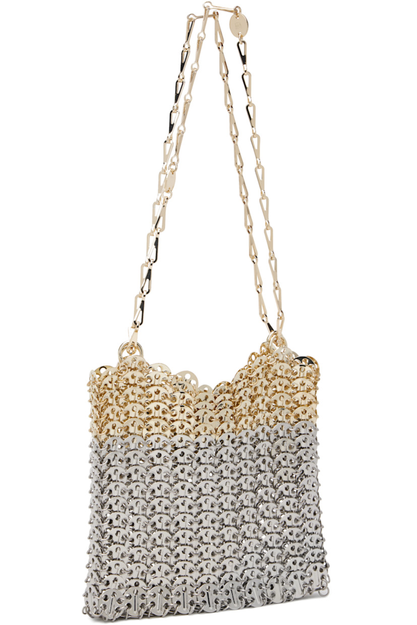 Handcrafted chain-mail-style shoulder bag in silver- and gold-tone brass.

· Sliding chain-link shoulder straps
· Logo plaque at shoulder strap
· Open throat
· Unlined
· H7" x W9" x D1"

Supplier color: Silver/Light gold