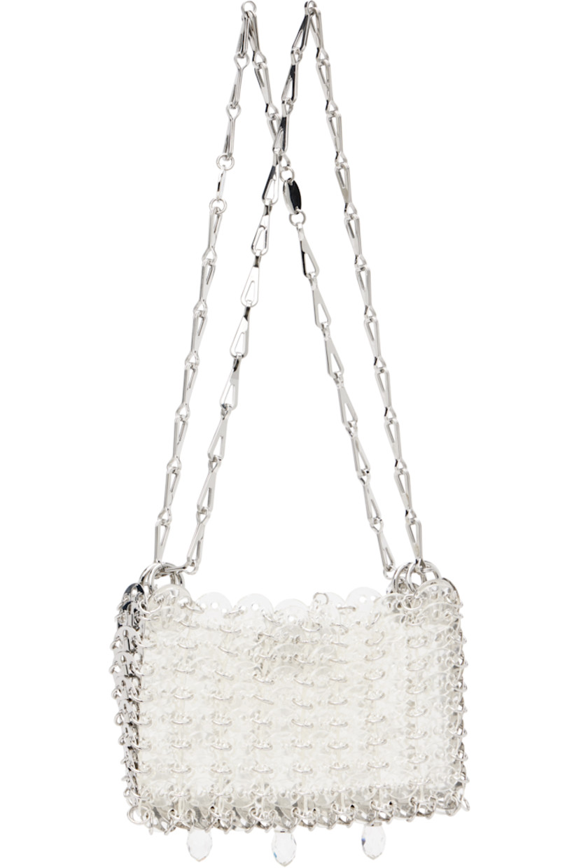 Handcrafted transparent resin chain mail-style shoulder bag.

· Sliding chain-link shoulder straps
· Logo plaques at shoulder strap
· Crystal-cut appliqués at face
· Magnetic closure
· Unlined
· Logo-engraved silver-tone hardware
· H4.5" x W6.5" x D1"

Supplier color: Transparent/Crystal