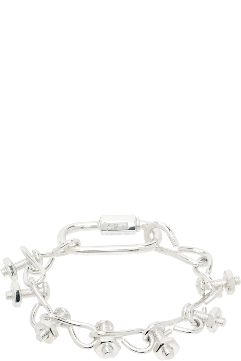 Modified cable chain bracelet in sterling silver.

· Graphic charms throughout
· Logo and hallmarking at screw fastening

Supplier color: 925 silver