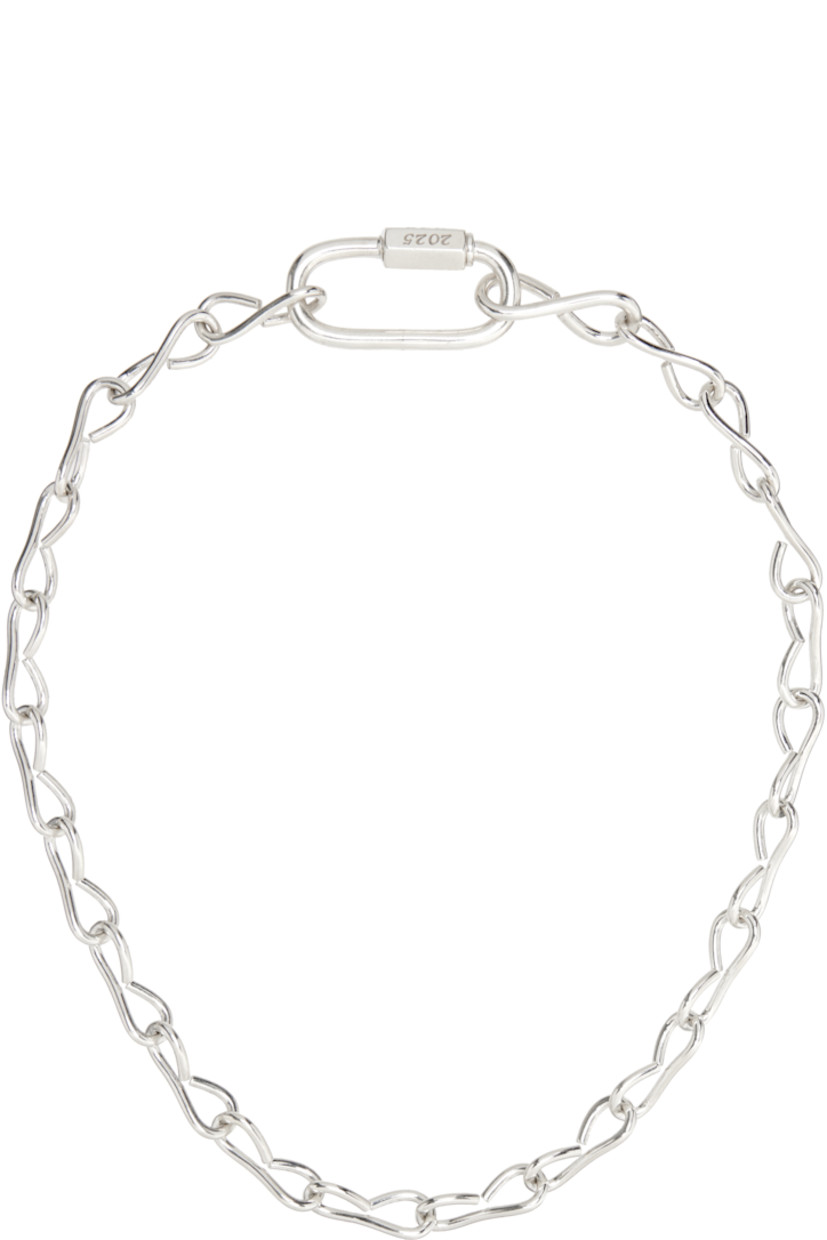 Modified cable chain necklace in sterling silver. Logo and hallmarking engraved at screw fastening.

Supplier color: 925 silver