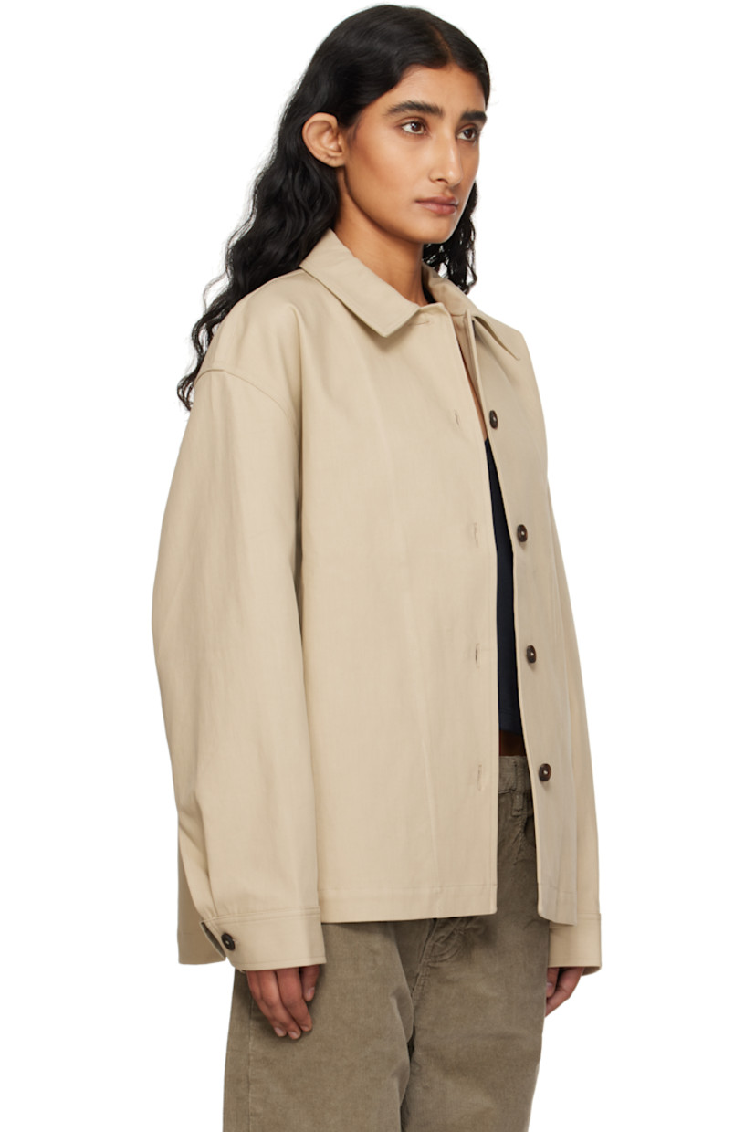 Cotton twill jacket. 

· Spread collar
· Button closure
· Seam pockets at waist
· Dropped shoulders
· Pleat at buttoned barrel cuffs
· Patch pocket at interior 
· Unlined

Supplier color: Sand