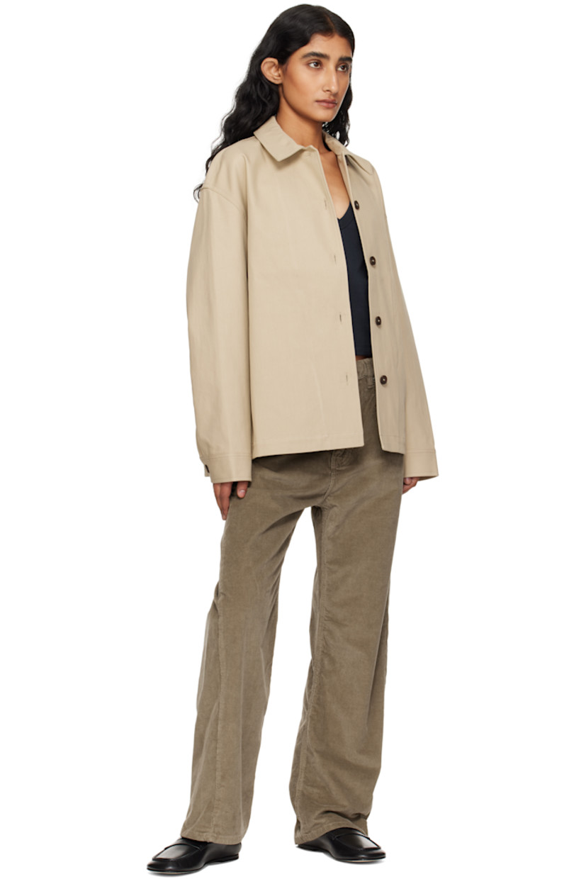 Cotton twill jacket. 

· Spread collar
· Button closure
· Seam pockets at waist
· Dropped shoulders
· Pleat at buttoned barrel cuffs
· Patch pocket at interior 
· Unlined

Supplier color: Sand