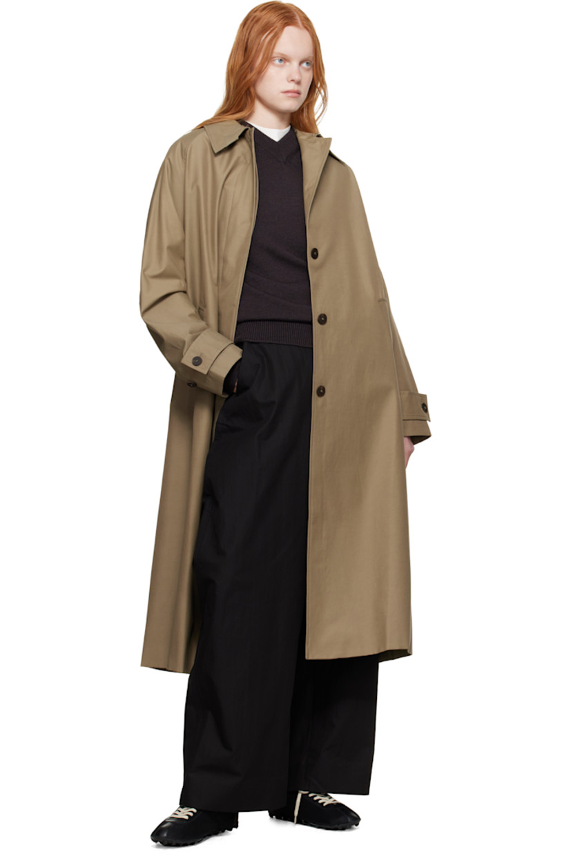 Lightweight cotton-blend gabardine trench coat.

· Water-repellent
· Hook-eye fastening at spread collar
· Concealed button closure
· Welt pockets
· Raglan sleeves
· Adjustable button tab at cuffs
· Central vent at back hem
· Patch pocket at interior
· Full twill lining

Supplier color: Dark dusk