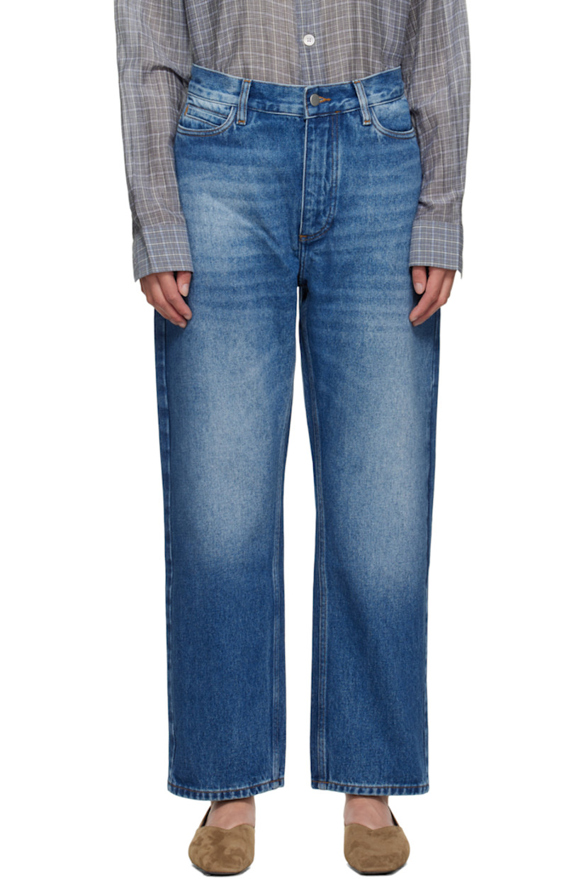 14 oz non-stretch regenerative cotton-blend denim jeans.

· Whiskering and fading throughout
· Loose-fit
· High-rise
· Belt loops
· Five-pocket styling
· Zip fly
· Cropped legs
· Curved outseams
· Leather logo patch at back waistband
· Contrast stitching in tan

Supplier color: Worn wash indigo