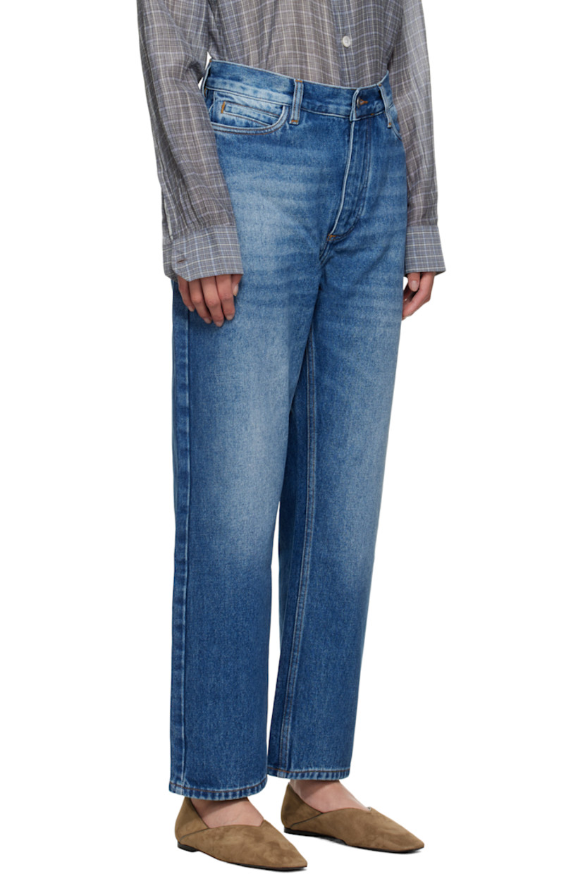 14 oz non-stretch regenerative cotton-blend denim jeans.

· Whiskering and fading throughout
· Loose-fit
· High-rise
· Belt loops
· Five-pocket styling
· Zip fly
· Cropped legs
· Curved outseams
· Leather logo patch at back waistband
· Contrast stitching in tan

Supplier color: Worn wash indigo
