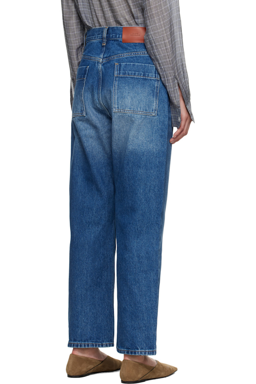 14 oz non-stretch regenerative cotton-blend denim jeans.

· Whiskering and fading throughout
· Loose-fit
· High-rise
· Belt loops
· Five-pocket styling
· Zip fly
· Cropped legs
· Curved outseams
· Leather logo patch at back waistband
· Contrast stitching in tan

Supplier color: Worn wash indigo