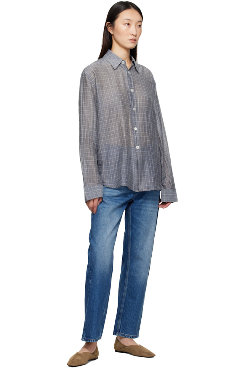 14 oz non-stretch regenerative cotton-blend denim jeans.

· Whiskering and fading throughout
· Loose-fit
· High-rise
· Belt loops
· Five-pocket styling
· Zip fly
· Cropped legs
· Curved outseams
· Leather logo patch at back waistband
· Contrast stitching in tan

Supplier color: Worn wash indigo