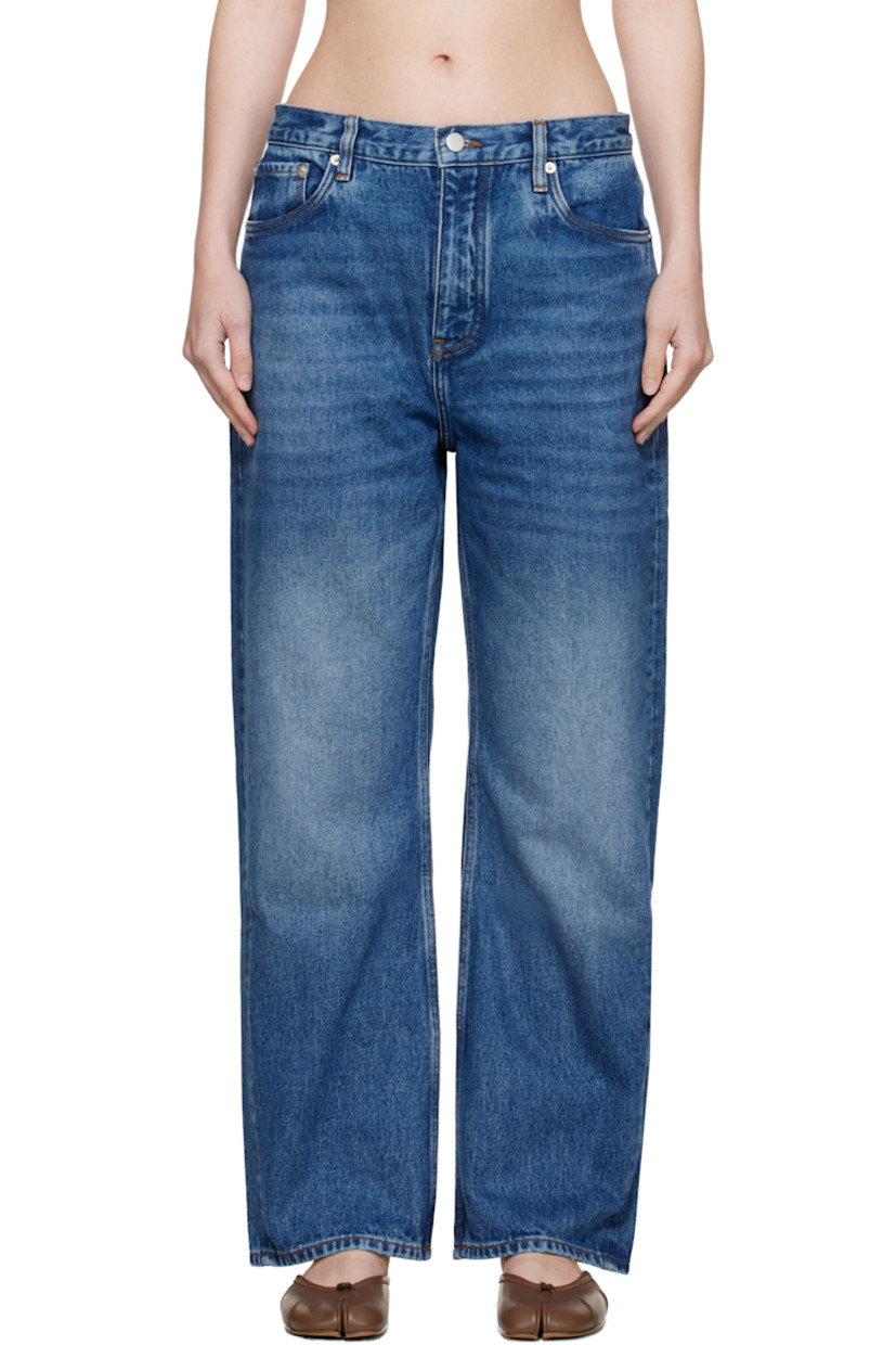 Non-stretch regenerative cotton-blend denim jeans.

· Fading and whiskering throughout
· Wide-leg
· Belt loops
· Five-pocket styling
· Zip fly
· Logo patch at back waistband
· Contrast stitching in yellow

Supplier color: Worn wash indigo