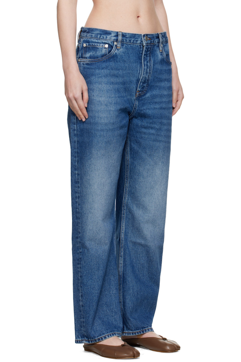 Non-stretch regenerative cotton-blend denim jeans.

· Fading and whiskering throughout
· Wide-leg
· Belt loops
· Five-pocket styling
· Zip fly
· Logo patch at back waistband
· Contrast stitching in yellow

Supplier color: Worn wash indigo