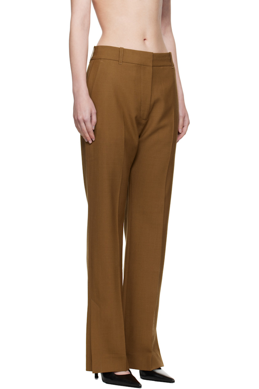 Wool canvas trousers.

· Straight-leg
· Belt loops
· Four-pocket styling
· Zip fly
· Creased legs
· Vented cuffs
· Partial twill lining

Supplier color: Tobacco