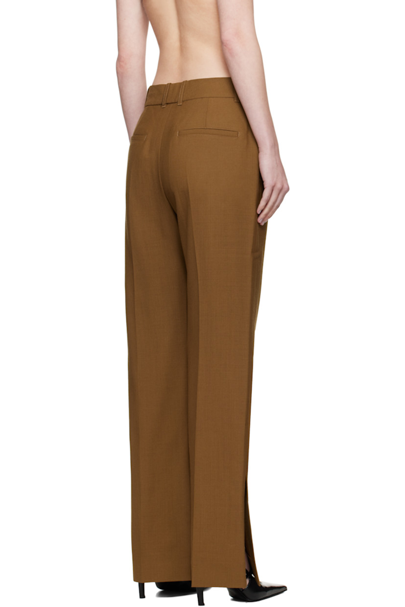Wool canvas trousers.

· Straight-leg
· Belt loops
· Four-pocket styling
· Zip fly
· Creased legs
· Vented cuffs
· Partial twill lining

Supplier color: Tobacco