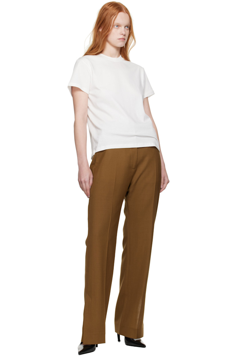 Wool canvas trousers.

· Straight-leg
· Belt loops
· Four-pocket styling
· Zip fly
· Creased legs
· Vented cuffs
· Partial twill lining

Supplier color: Tobacco
