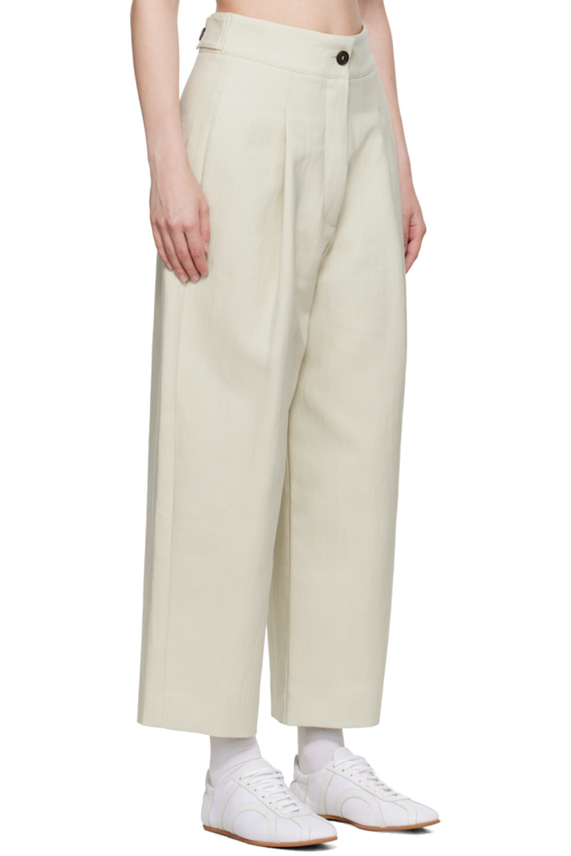 Crinkled cotton-blend twill trousers.

· Four-pocket styling
· Zip fly
· Pleats at front
· Creased legs
· Adjustable button tabs at back waistband

Supplier color: Dove