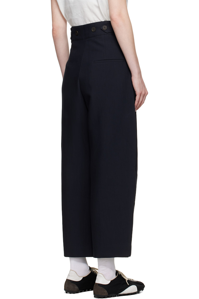 Crinkled cotton-blend twill trousers.

· Four-pocket styling
· Zip fly
· Pleats at front
· Creased legs
· Adjustable button tabs at back waistband

Supplier color: Darkest navy