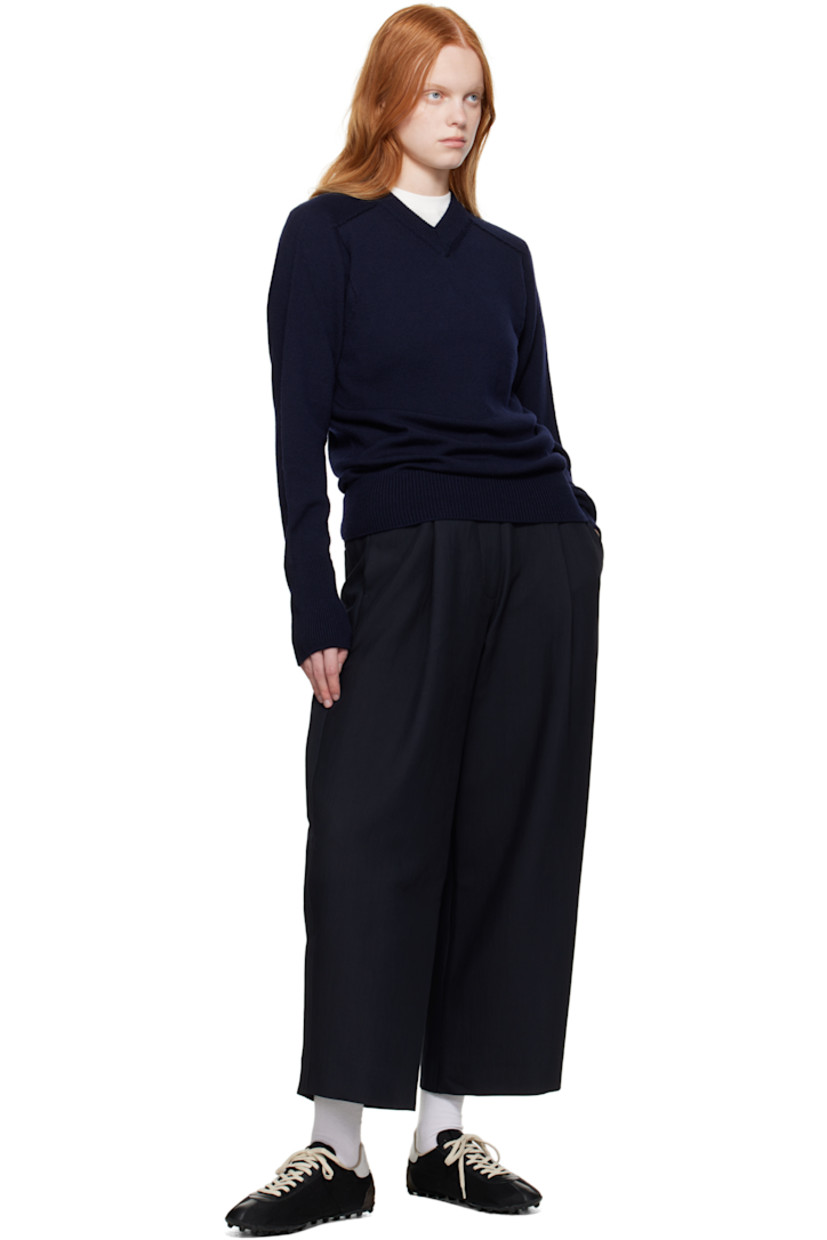 Crinkled cotton-blend twill trousers.

· Four-pocket styling
· Zip fly
· Pleats at front
· Creased legs
· Adjustable button tabs at back waistband

Supplier color: Darkest navy