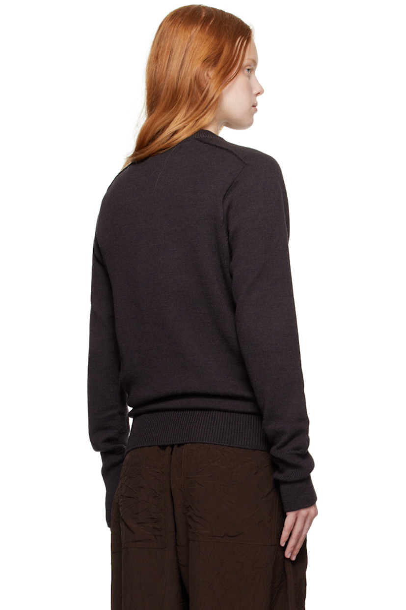 Knit extrafine merino wool sweater.

· Rib-knit V-neck, hem, and cuffs
· Saddle shoulders

Supplier color: Walnut
