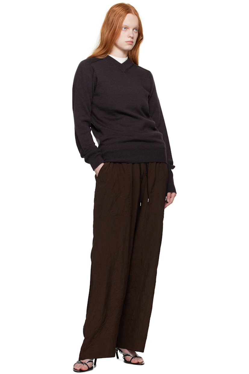 Knit extrafine merino wool sweater.

· Rib-knit V-neck, hem, and cuffs
· Saddle shoulders

Supplier color: Walnut