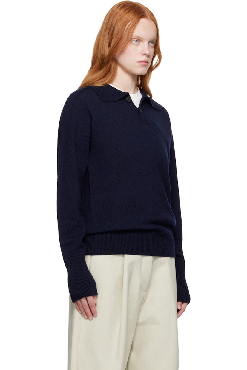 Knit extrafine merino wool polo.

· Rib-knit spread collar, hem, and cuffs
· Two-button placket
· Saddle shoulders

Supplier color: Navy