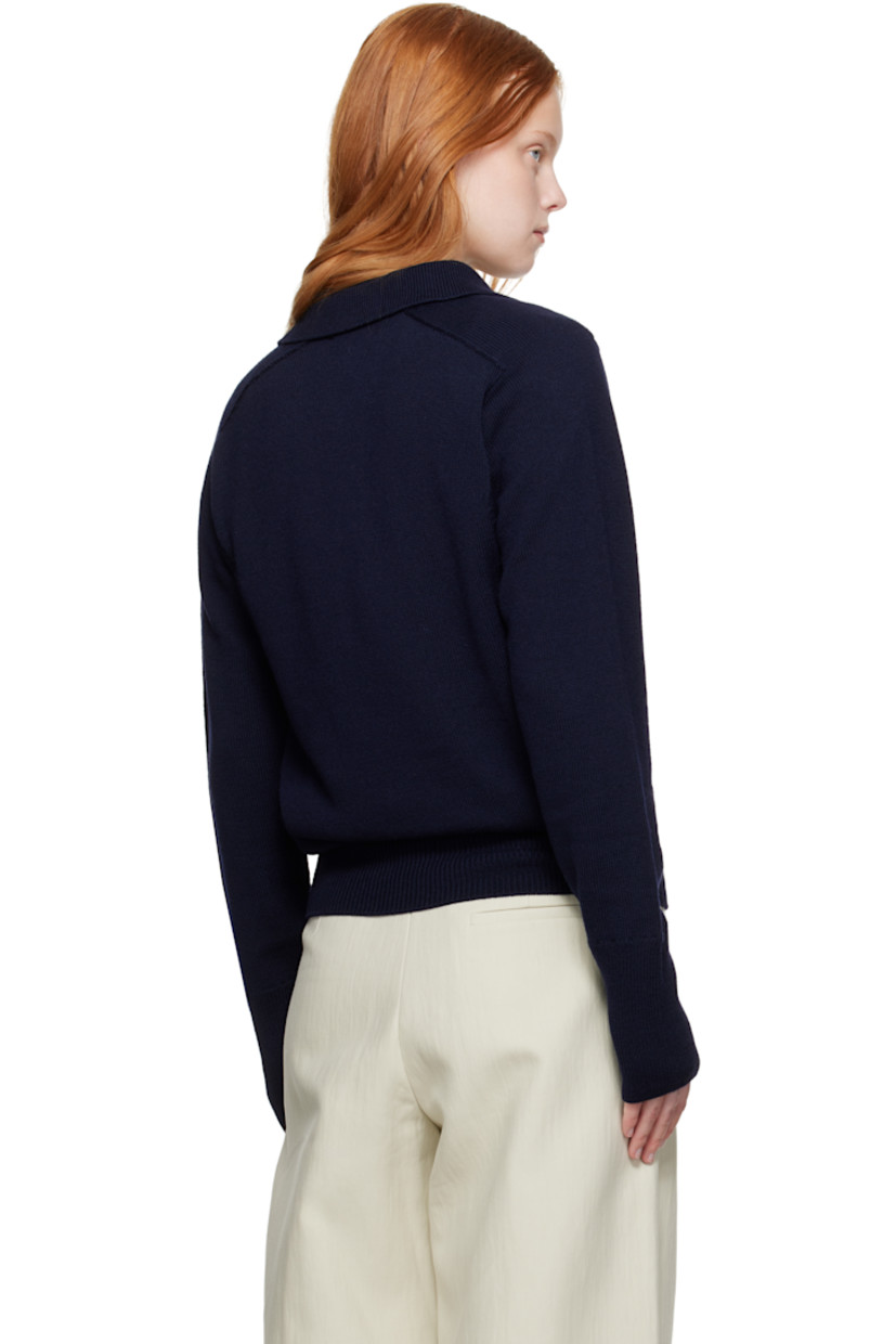Knit extrafine merino wool polo.

· Rib-knit spread collar, hem, and cuffs
· Two-button placket
· Saddle shoulders

Supplier color: Navy