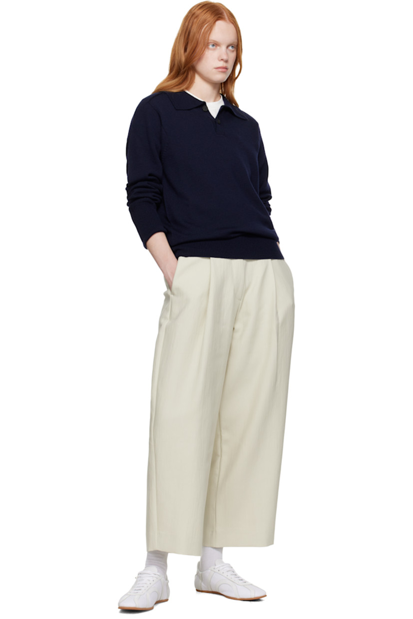 Knit extrafine merino wool polo.

· Rib-knit spread collar, hem, and cuffs
· Two-button placket
· Saddle shoulders

Supplier color: Navy