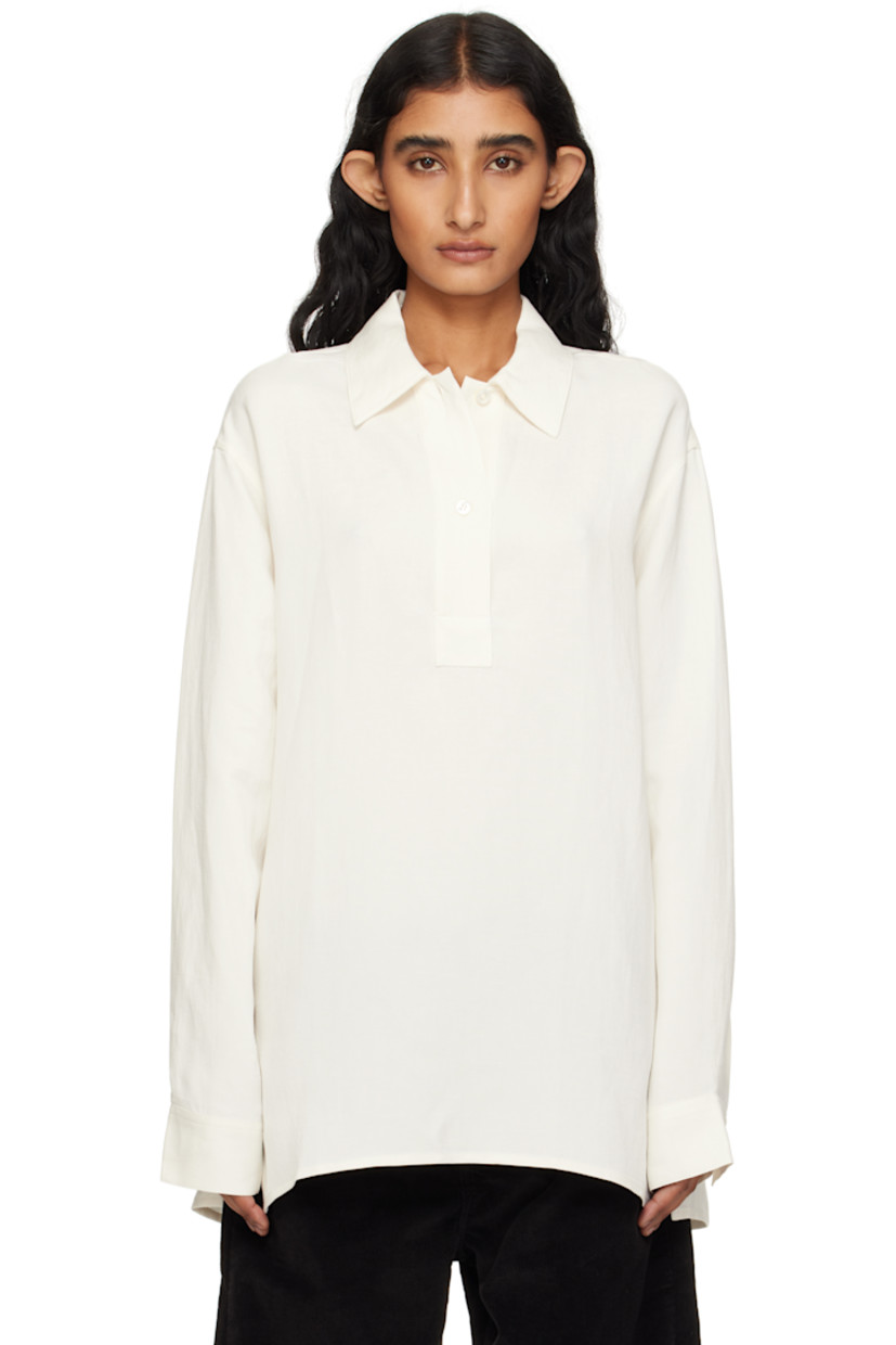 Viscose- and linen-blend hopsack shirt. 

· Spread collar
· Concealed two-button placket
· Vented side seams
· Droptail hem 
· Pleats at buttoned barrel cuffs
· Dropped shoulders

Supplier color: Chalk