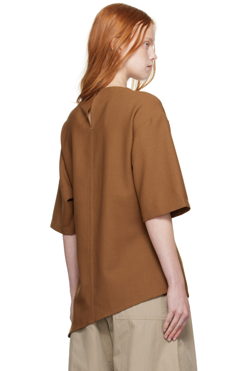 Wool canvas top.

· Crewneck
· Asymmetrical hem
· Vent at side seam
· Button fastening at back collar

Supplier color: Tobacco