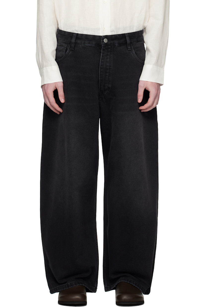 Non-stretch 14 oz regenerative cotton-blend denim jeans.

· Subtle fading and whiskering throughout
· Tapered and wide-leg
· Belt loops
· Five-pocket styling
· Zip fly
· Leather logo patch at back waistband

Supplier color: Washed black