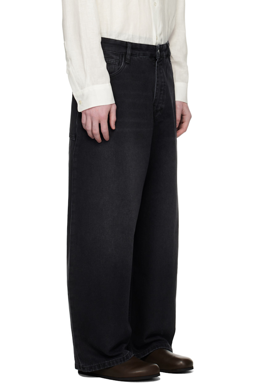 Non-stretch 14 oz regenerative cotton-blend denim jeans.

· Subtle fading and whiskering throughout
· Tapered and wide-leg
· Belt loops
· Five-pocket styling
· Zip fly
· Leather logo patch at back waistband

Supplier color: Washed black